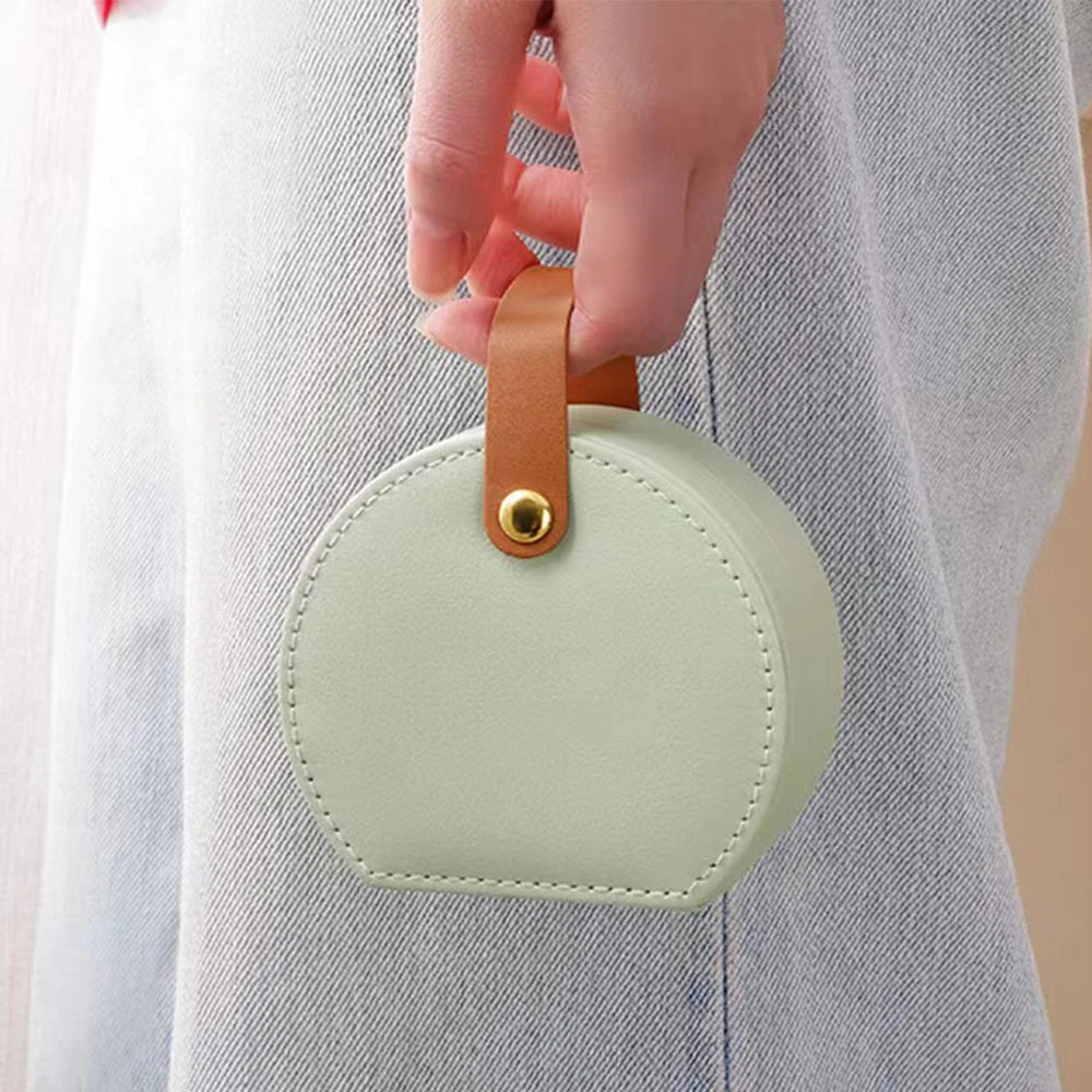 Élégance nomade: la boîte à bijoux ronde compacte