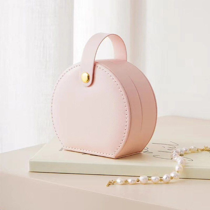 Élégance nomade: la boîte à bijoux ronde compacte