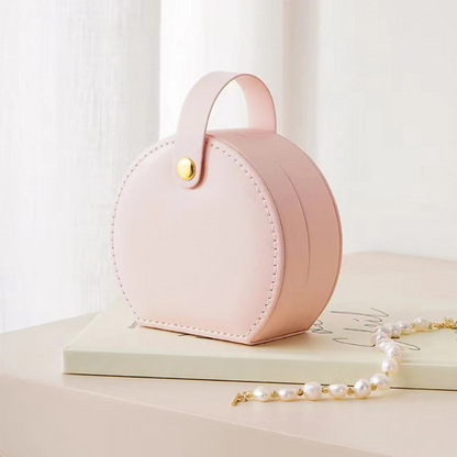 Élégance nomade: la boîte à bijoux ronde compacte
